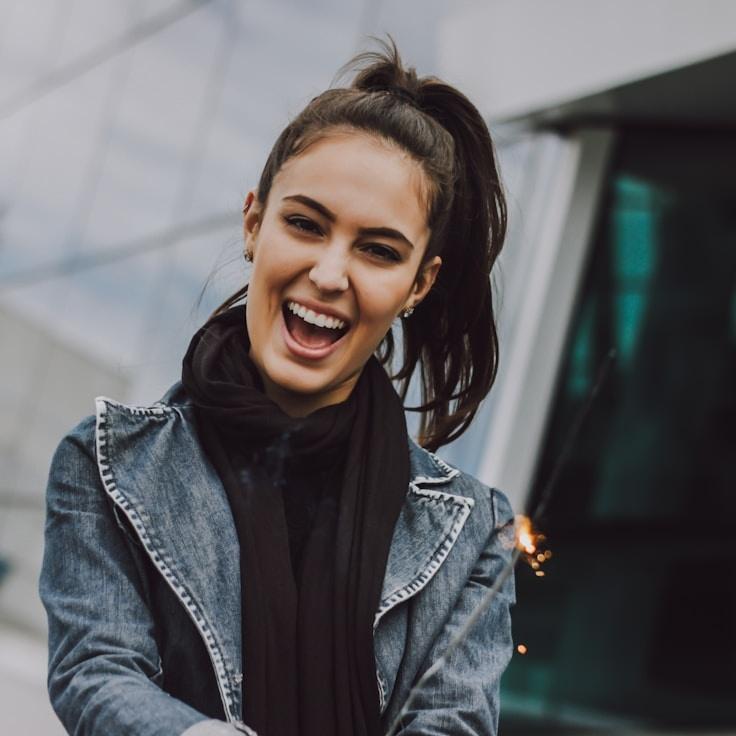 Avery Cole, Lead Design Curator at Grove Frame Portal, reviewing corporate floral arrangements